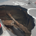 Mysterious sinkhole appears in UK and almost gobbles post box - motorists beware 