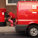 A Royal Mail employee empties a post box. Some households in West Yorkshire may experience Royal Mail delivery delays this weekend (Photo: Oli Scarff/Getty Images)