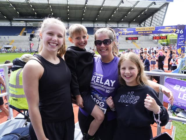 Lindsey Burrow and her children - Macy, Jackson and Maya - at the finish line