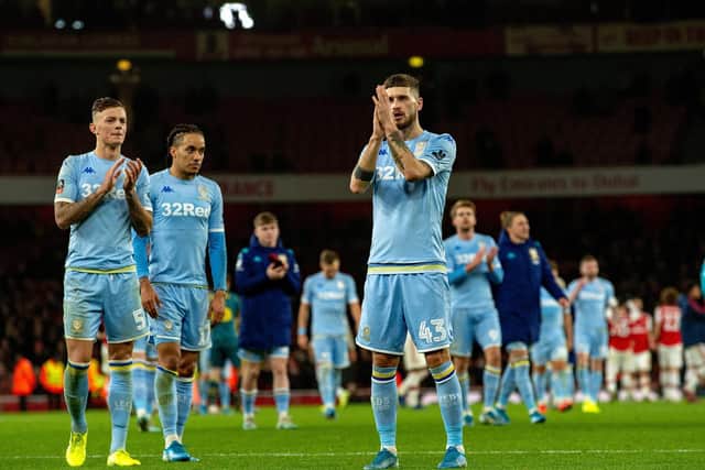 Leeds United players applaud the huge travelling support that roared them on against Arsenal. Picture: Bruce Rollinson