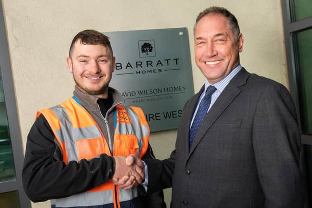 National Winner: Apprentice of the Year Wesley Bett is pictured with construction director Darren Johnson.