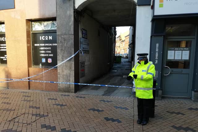 Police have cordoned off a Wakefield city centre street as they continue their investigations into a firearms incident. Photo: Nick Frame