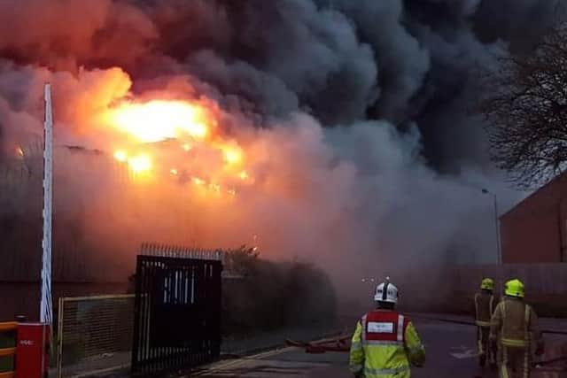 The blaze taking hold with the Lawefield Way homes to the right of the picture. (supplied by West Yorkshire Fire and Rescue Service)