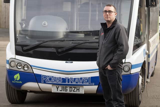 Ross Travel director Paul Bullock with one of the service buses that have been targeted by vandals in Pontefract. Picture Scott Merrylees