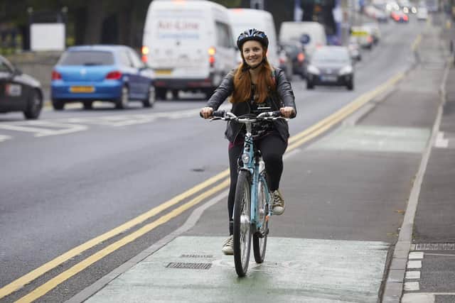 A cyclist beats the traffic in Armley on the 23km-long  Bradford to Leeds Cycle Superhighway. Picture: John Hutchinson