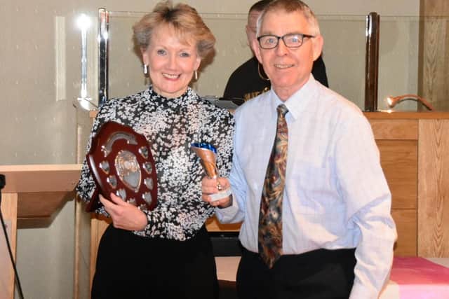 Christine McCarthy receives the Cyril Jones Athlete of the Year Award from Cyril Jones.