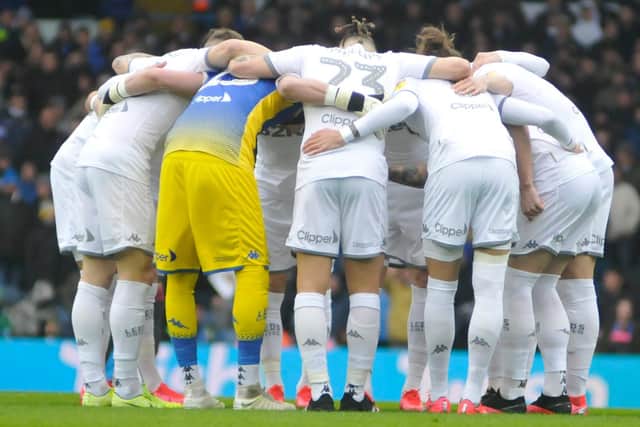 Leeds United players go into a huddle before their game against Reading.