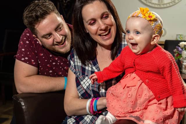Tara and Alex McHale with their daughter Minnie, who could face a second heart surgery in less than a year.