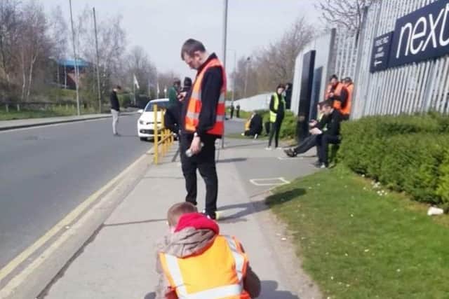 Pictures circulating on social media showed workers having to take lunch on the pavement.