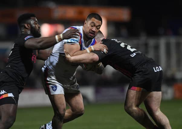 WRAPPED UP: Wakefield's Tinirau Arona is tackled by Bradford's Levy Nzoungou and Ebon Scurr during the Challenge Cup win.Picture Jonathan Gawthorpe13th March 2020.