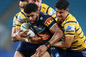 Gold Coast Titans' Kallum Watkins is tackled during the round 2 NRL match against  Parramatta Eels at Cbus Super Stadium last month (Photo by Chris Hyde/Getty Images)