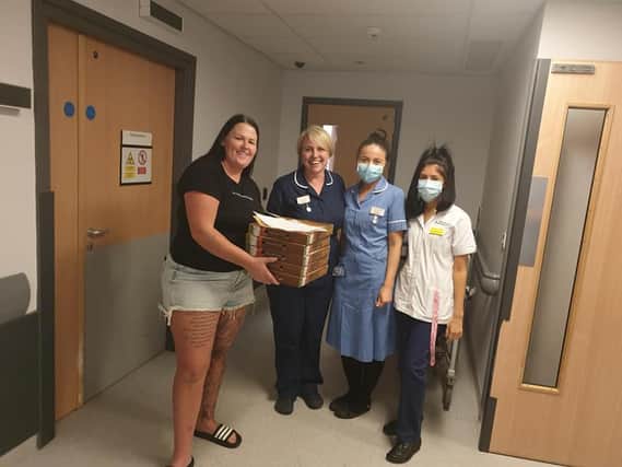 Marie delivered 40 pizzas to thank the doctors and nurses for their service