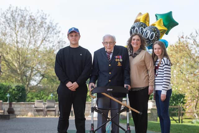 Captain Tom Moore, with (left to right) grandson Benji, daughter Hannah Ingram-Moore and granddaughter Georgia, at his home in Marston Moretaine, Bedfordshire. Picture: Joe Giddens/PA