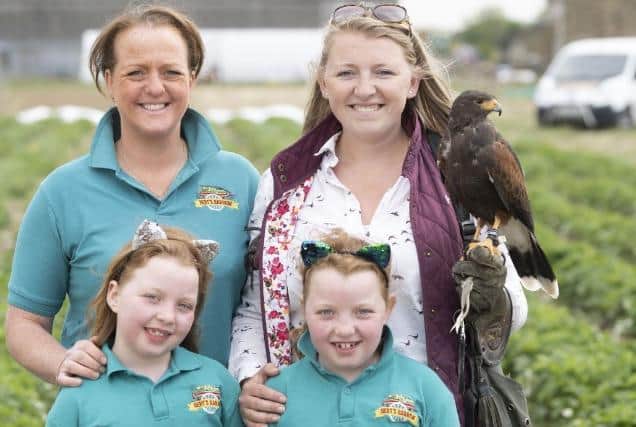 Charlotte Wells-Thompson (left) with her two daughters Hattie and Tilly, Kira Weston from KL Falconry and Geoff the Harris Hawk.