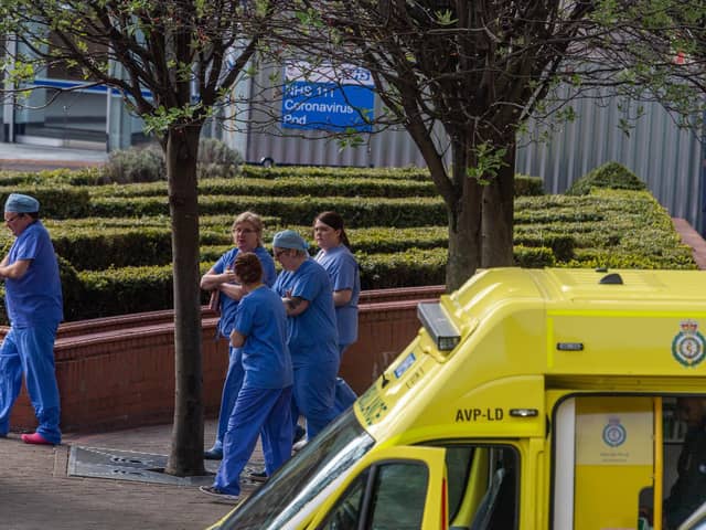 Pictured: NHS staff outside Leeds General Infirmary.