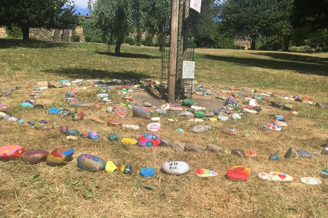 A snake made up of more than 250 rocks has also appeared around a tree in Pontefract Valley Gardens
