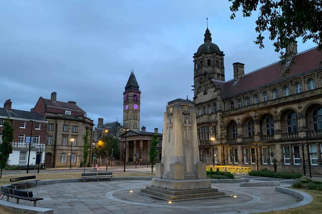 Wakefield town hall was lit purple on Wednesday night, in solidarity with protesters around the world. Photo: Michael Graham