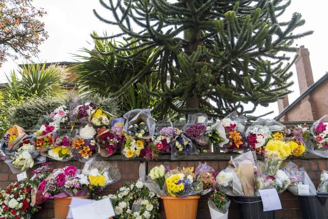 Dozens of floral tributes have been left on Leeds Road, Outwood.