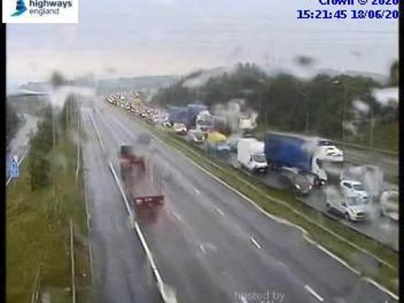More than eight miles of traffic has been reported on the M62 this afternoon after heavy rain flooded the carriageway. Photo: Highways England