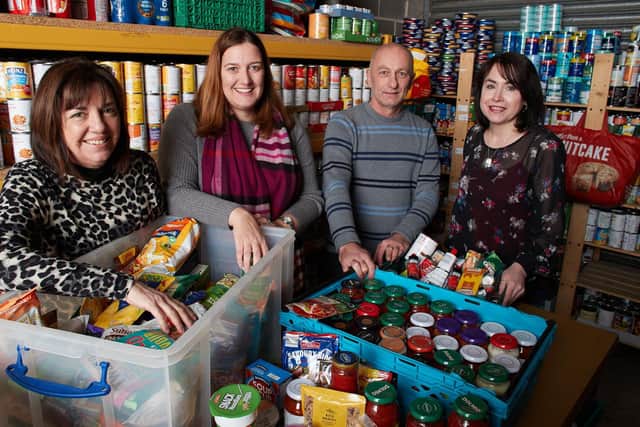 Providing: Lisa Grant (far right) with volunteers at St Catherines Food Bank, pictured prior to lockdown.