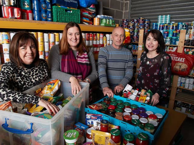 Providing: Lisa Grant (far right) with volunteers at St Catherines Food Bank, pictured prior to lockdown.