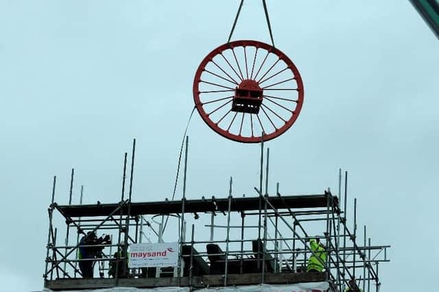 The wheel is put into place.