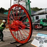 Newly restored Pit wheel is put into place at the National Mining Museum, Wakefield.Picture by Simon Hulme.