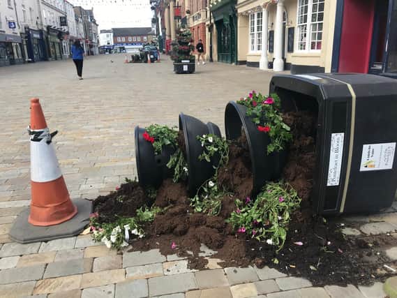 Vandals stole plants and uprooted hundreds of flowers from community planters in Pontefract. Photo: Colin White
