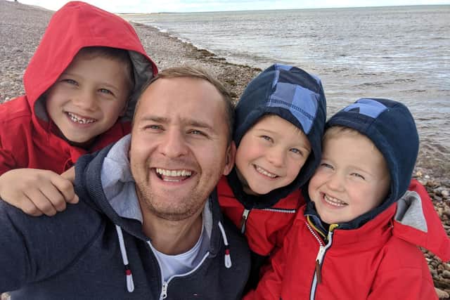 Dale Tate, pictured with three of his sons, hopes to relocate his family to his wife's native Australia.