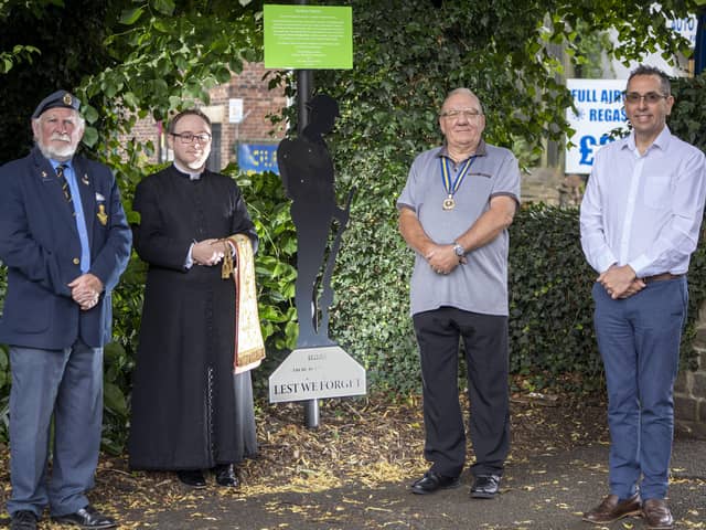 John Lockwood, Father Christopher Johnson, Malcom Patterson and Darren Byford with the 'Tommy' statue that has been installed in Horbury Memorial Park.
