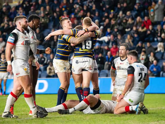 Picture by Allan McKenzie/SWpix.com - 05/03/2020 - Rugby League - Betfred Super League - Leeds Rhinos v Toronto Wolfpack - Emerald Headingley Stadium, Leeds, England - Toronto's dejection shows as Leeds's Mikolaj Oledzki is congratulated by Callum McLelland on his try.