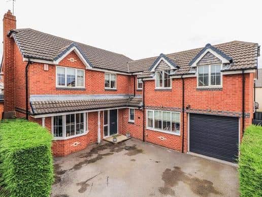 This detached home in a quiet location at the head of a cul-de-sac has five bedrooms, and is arranged over two floors.