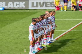 Wakefield Trinity players stay stood during the Black Lives Matter (BLM) demonstration. Picture: Alex Whitehead/SWpix.com.