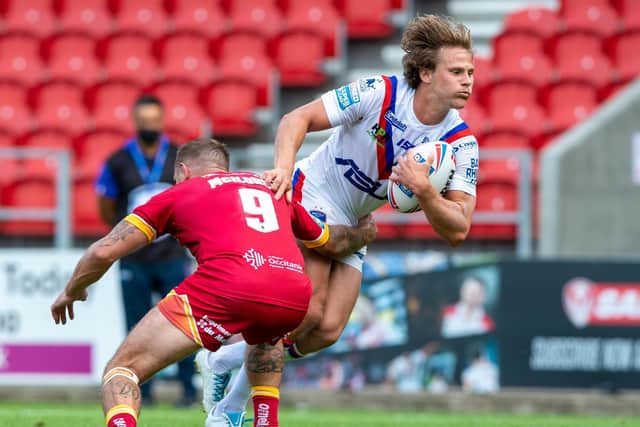 Wakefield Trinity v Catalans Dragons - Jacob Miller looks to get past a defender. Picture: Bruce Rollinson.