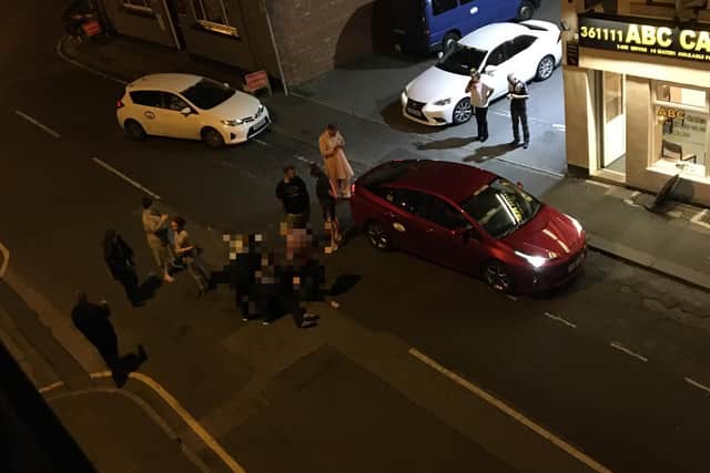 Police have launched an investigation into an assault on a taxi driver on a busy Wakefield street.