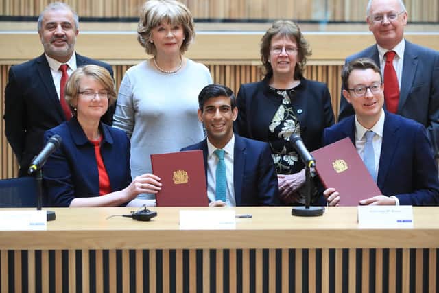 back row, left to right) Councillors Shabir Pandor, Denise Jeffery, Judith Blake and Tim Swift, (front row, left to right) Susan Hinchcliffe, Chancellor Rishi Sunak and Simon Clarke MP after the signing of the West Yorkshire Combined Authority devolution, at the Nexus Building at the University of Leeds. Photo: PA
