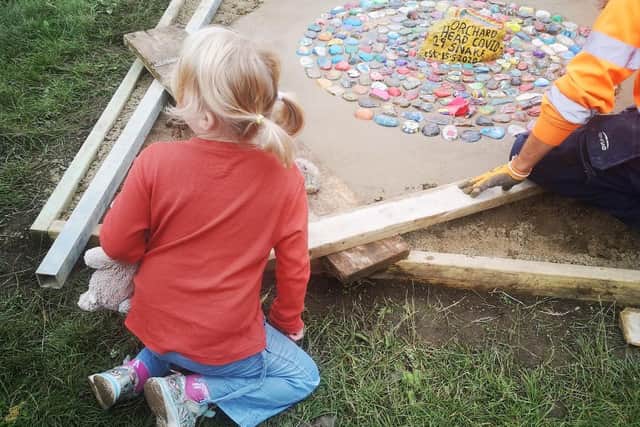 A little girl’s dream has become a reality as her Covid snake has been cemented in Orchard Head Park