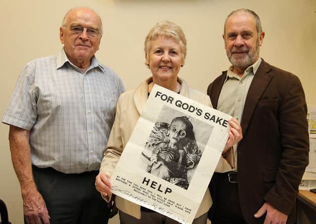 Suzy Fund founder  Brian Hazell, left, with Paul and Monica Haley who is holding up an appeal poster for the humanitarian charity.