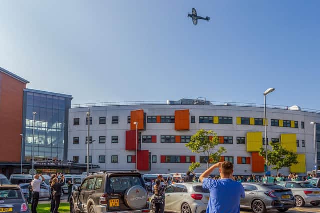 Hundreds of people gathered to watch as the NHS Spitfire passed over Pinderfields Hospital this morning. Photo: Lee Ward @ Law Photography