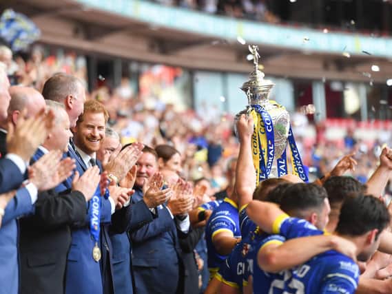 HRH Prince Harry, Duke of Sussex hands the trophy to Warrington Wolves, the winners of the 2019 Coral Challenge Cup Final at Wembley. (Simon Wilkinson/SWpix.com)