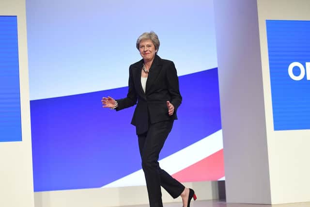 Prime Minister Theresa May dances as she arrives on stage to make her speech at the Conservative Party annual conference at the International Convention Centre, Birmingham in 2018. Pic: PA