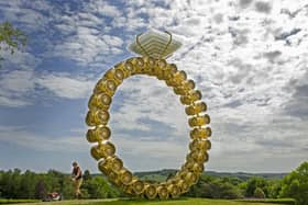 Operations worker Will Poppleton mows the grass around Portuguese artist Joana Vasconcelos' Solitaire at the Yorkshire Sculpture Park. Picture: Tony Johnson.