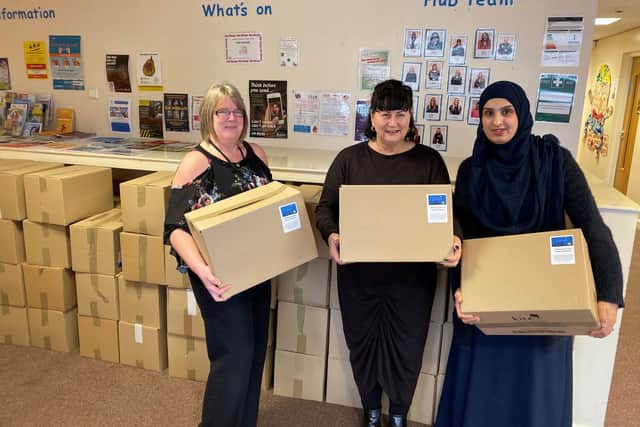 Staff at the Featherstone and South East Children First Hub with packed hampers in 2019
