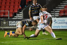 Leeds Rhinos' Ash Handley goes over for his side's only try in the defeat to Wakefield Trinity. Picture: Jonathan Gawthorpe/JPIMedia.