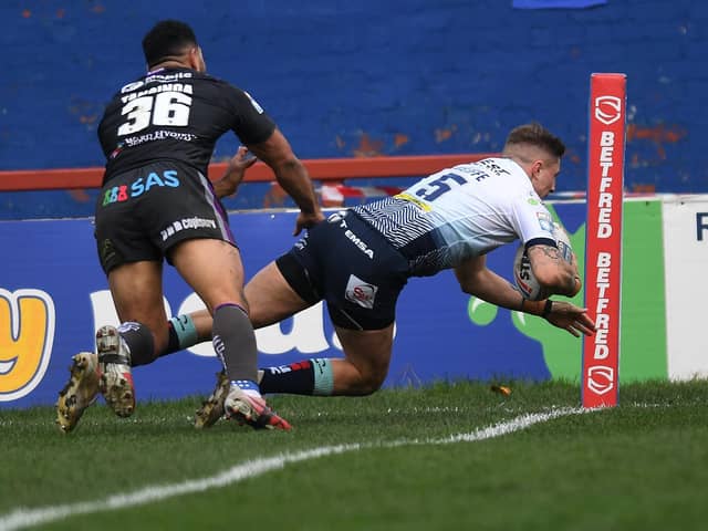 Liam Sutcliffe dives over for one of four Leeds Rhinos tries in the win at Wakefield Trinity. Picture: Jonathan Gawthorpe/JPIMedia.