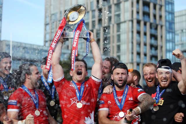 Picture by Vaughn Ridley/SWpix.com - 05/10/2019 - Rugby League - Betfred Championship Grand Final - Toronto Wolfpack v Featherstone Rovers - Lamport Stadium, Toronto, Canada - Captain Josh McCrone of the Toronto Wolfpack lifts the Betfred Championship Trophy.