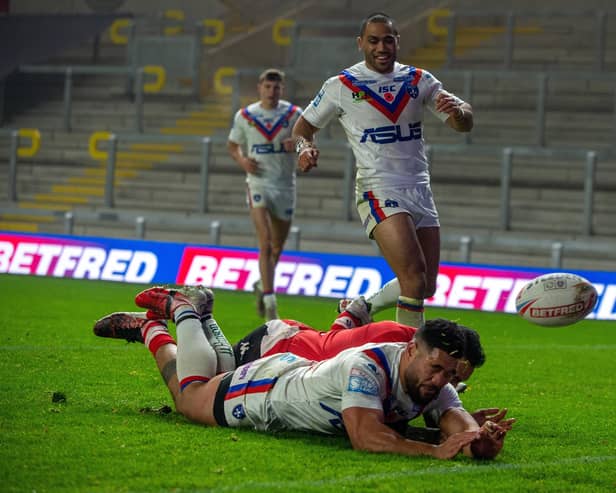 Brace: Wakefield forward Kelepi Taginoa touches down for Trinity's second try - the first of his pair. Picture Bruce Rollinson