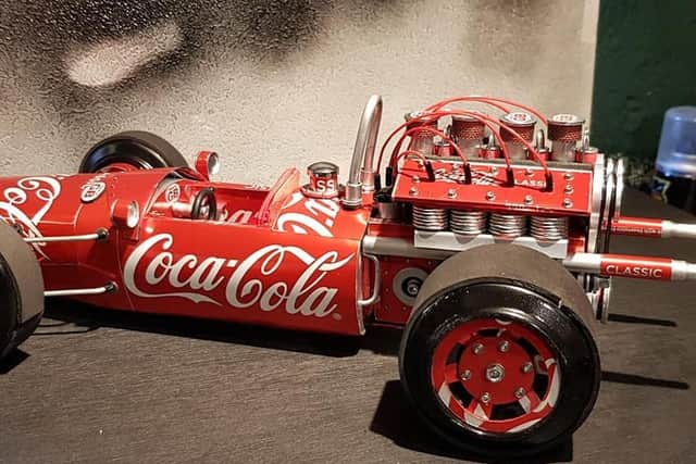 Lindsay Kirk, 57, has tinkered and tailored hundreds of cans of the popular soft drink into the incredibly detailed designs - including recreations of F1 cars.