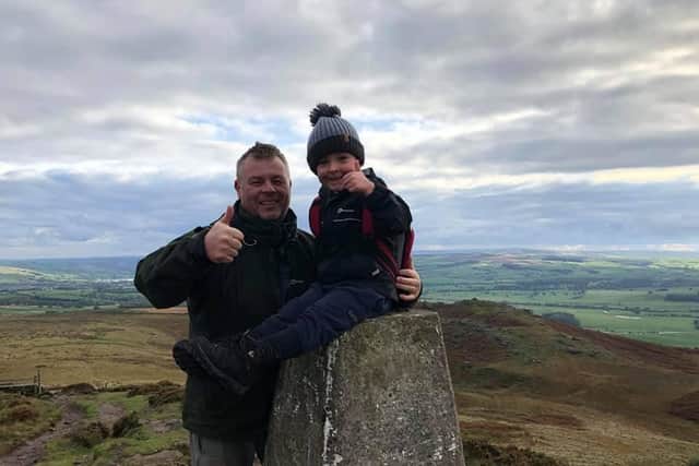 Charlie has climbed 53 mountains since his fifth birthday last April. He is pictured with dad Paul