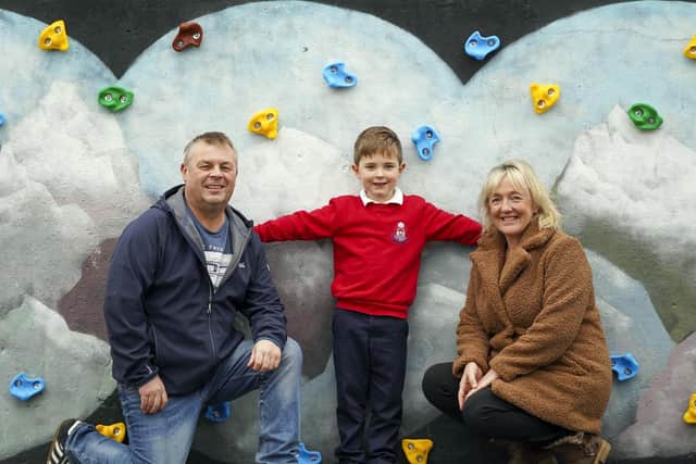 The climbing wall is accompanied by a mural from local artist Lizi Tebbutt, who runs Normanton’s Toast coffee house. Pictured is Charlie with parents Paul and Donna.